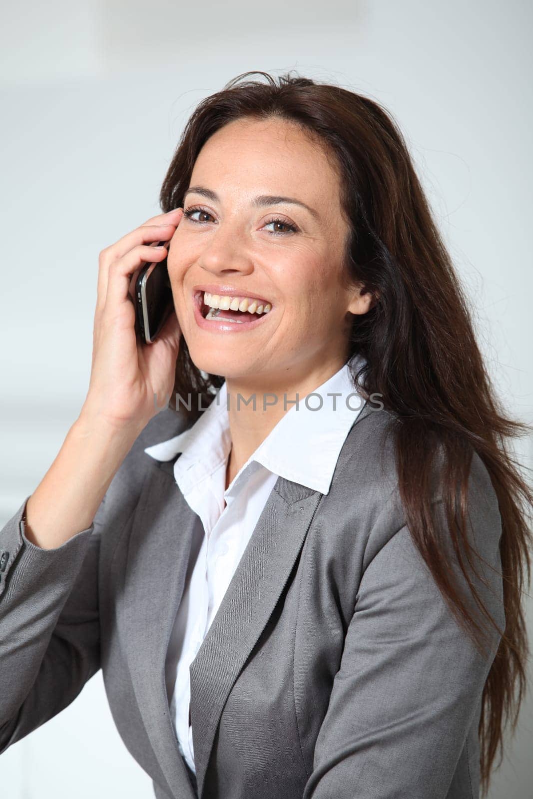 Closeup of businesswoman talking on mobile phone