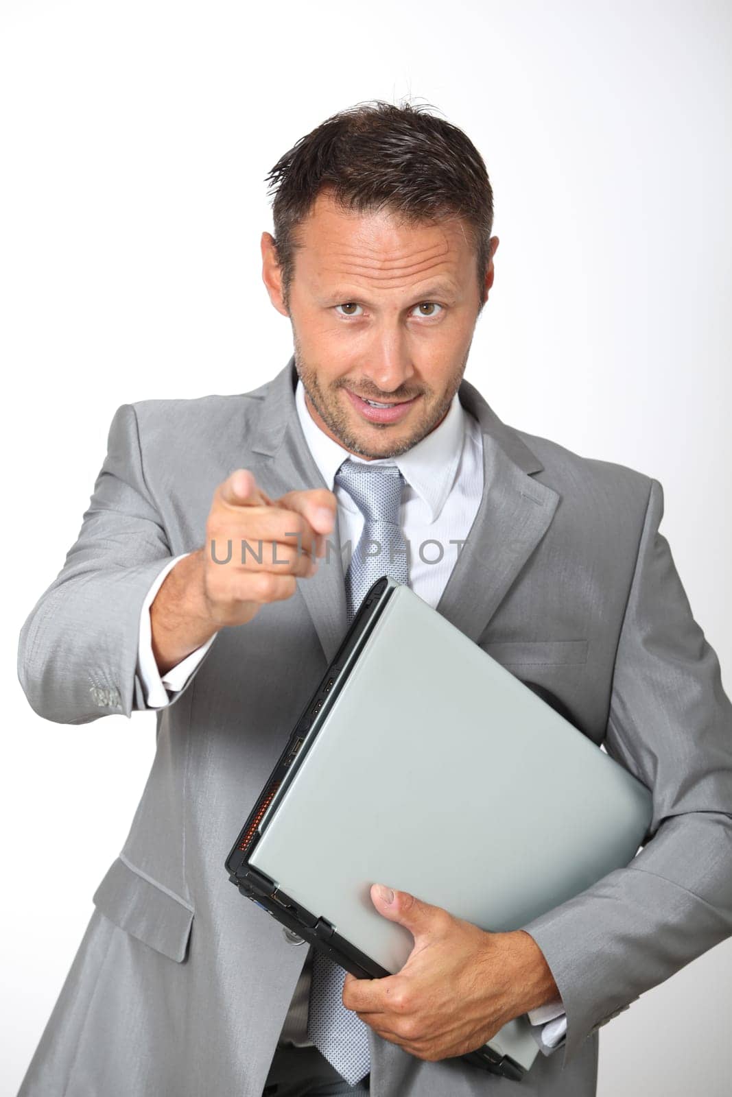 Businessman pointing at camera