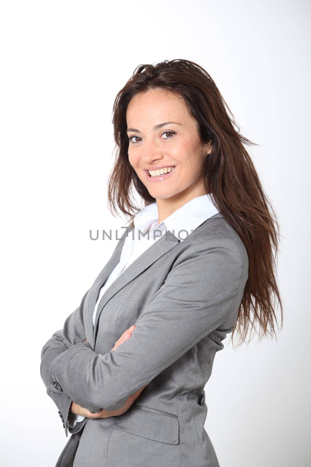 Smiling businesswoman with arms crossed