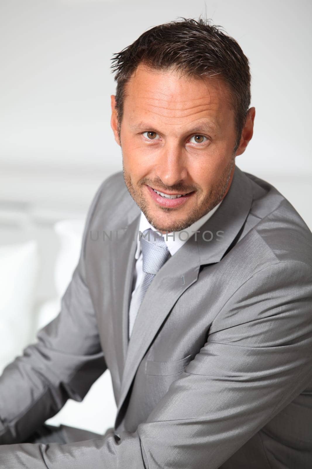 Closeup of businessman wearing grey suit