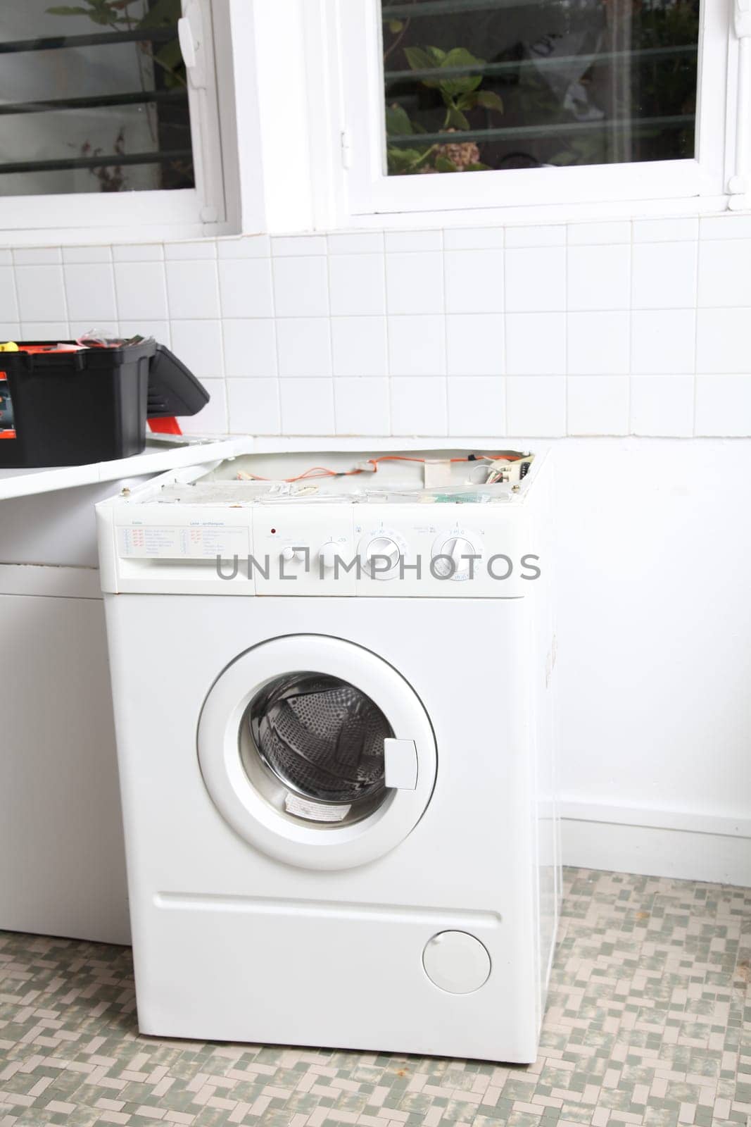 Closeup of washing machine in laundry