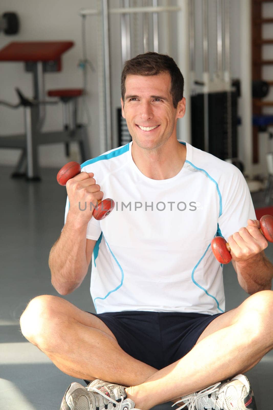 Closeup of man working out in gym