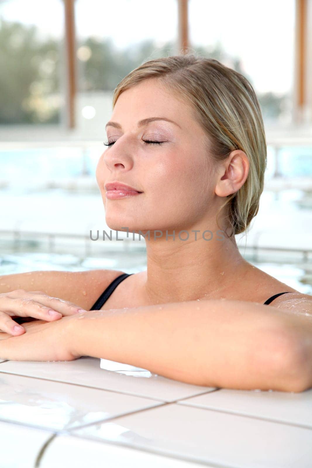 Closeup of beautiful woman in spa center