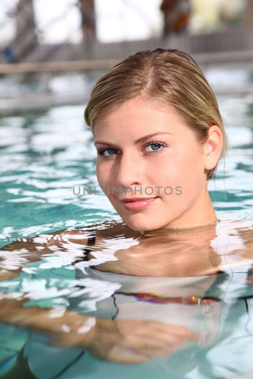 Closeup of beautiful woman in spa center