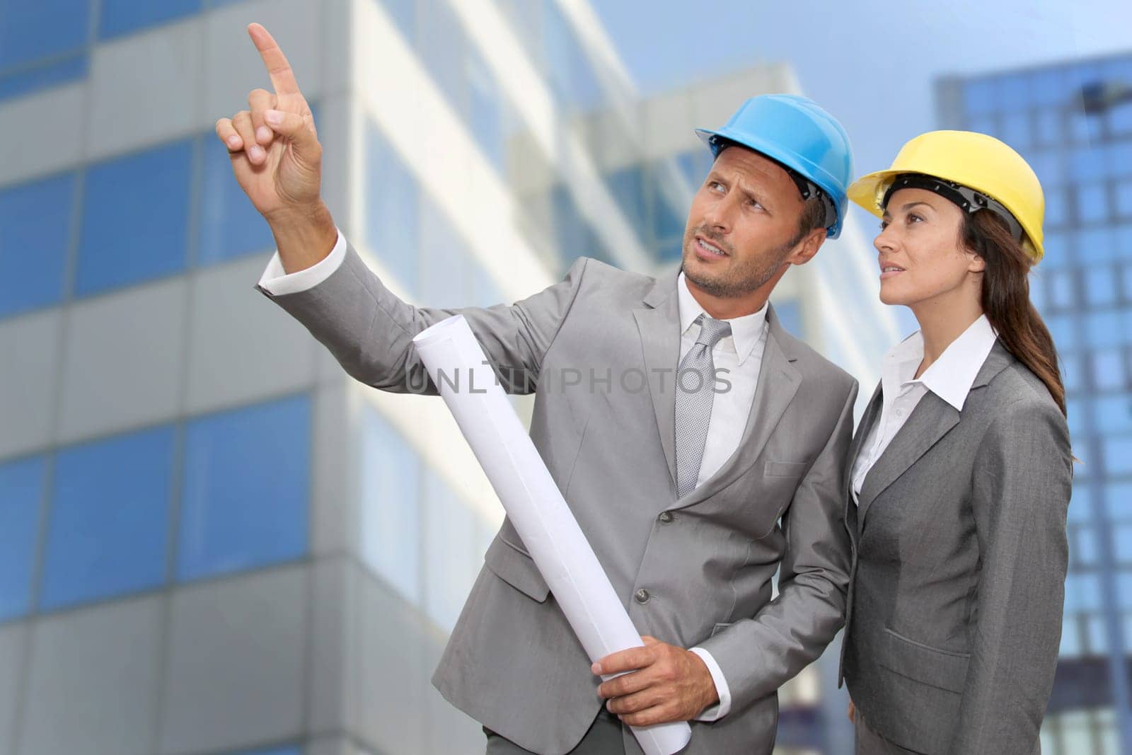 Construction engineer in front of modern building