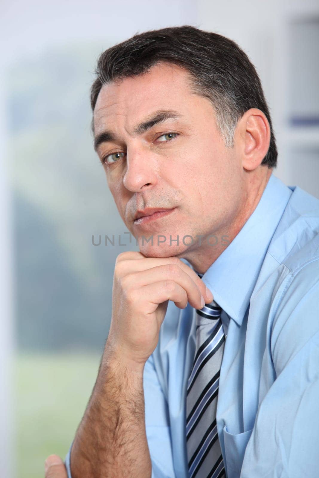 Closeup of businessman with blue shirt and tie