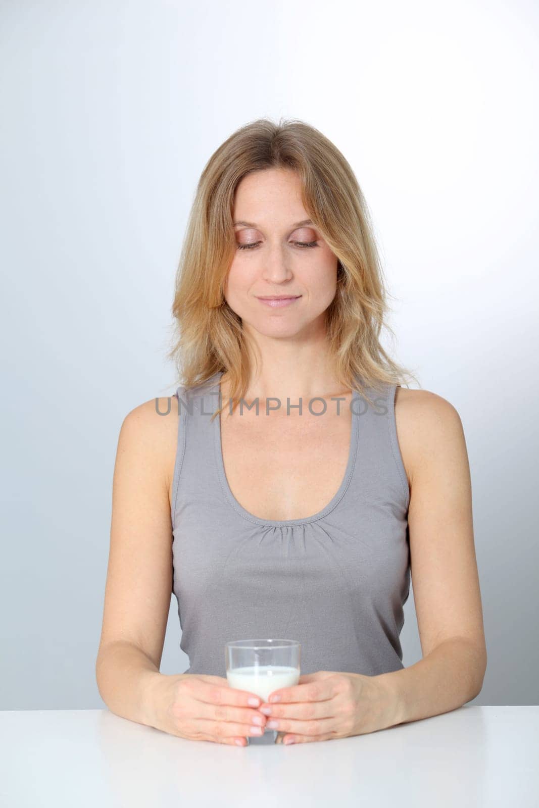 Closeup of beautiful woman drinking milk