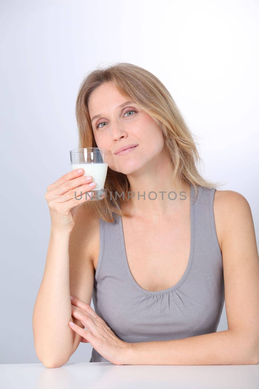 Closeup of beautiful woman drinking milk