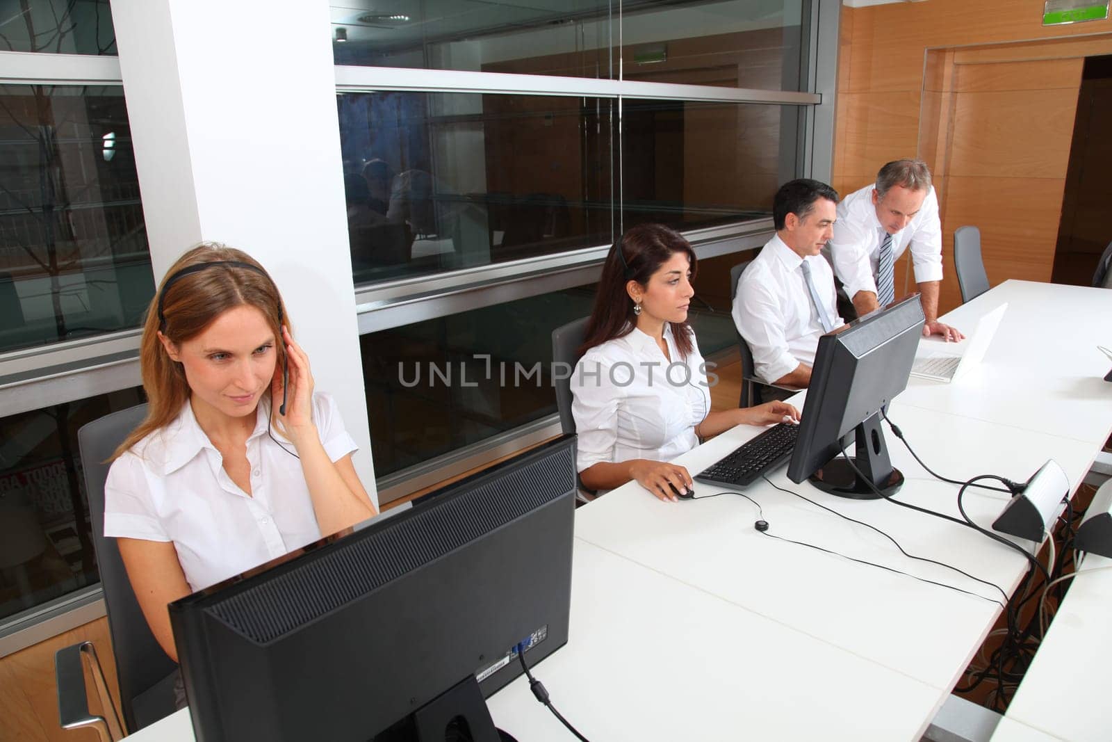 Blond businesswoman with headset on