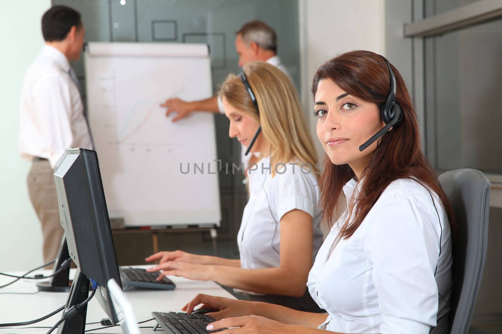 Group of people attending business presentation