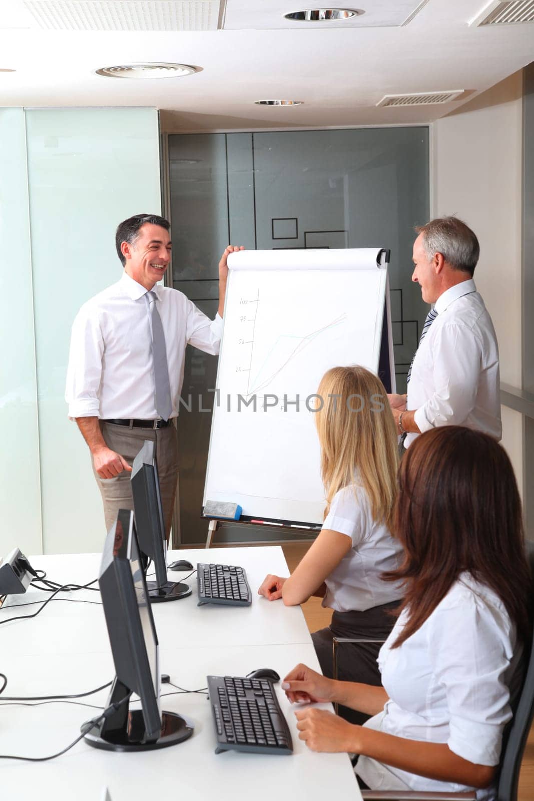 Group of people attending business presentation