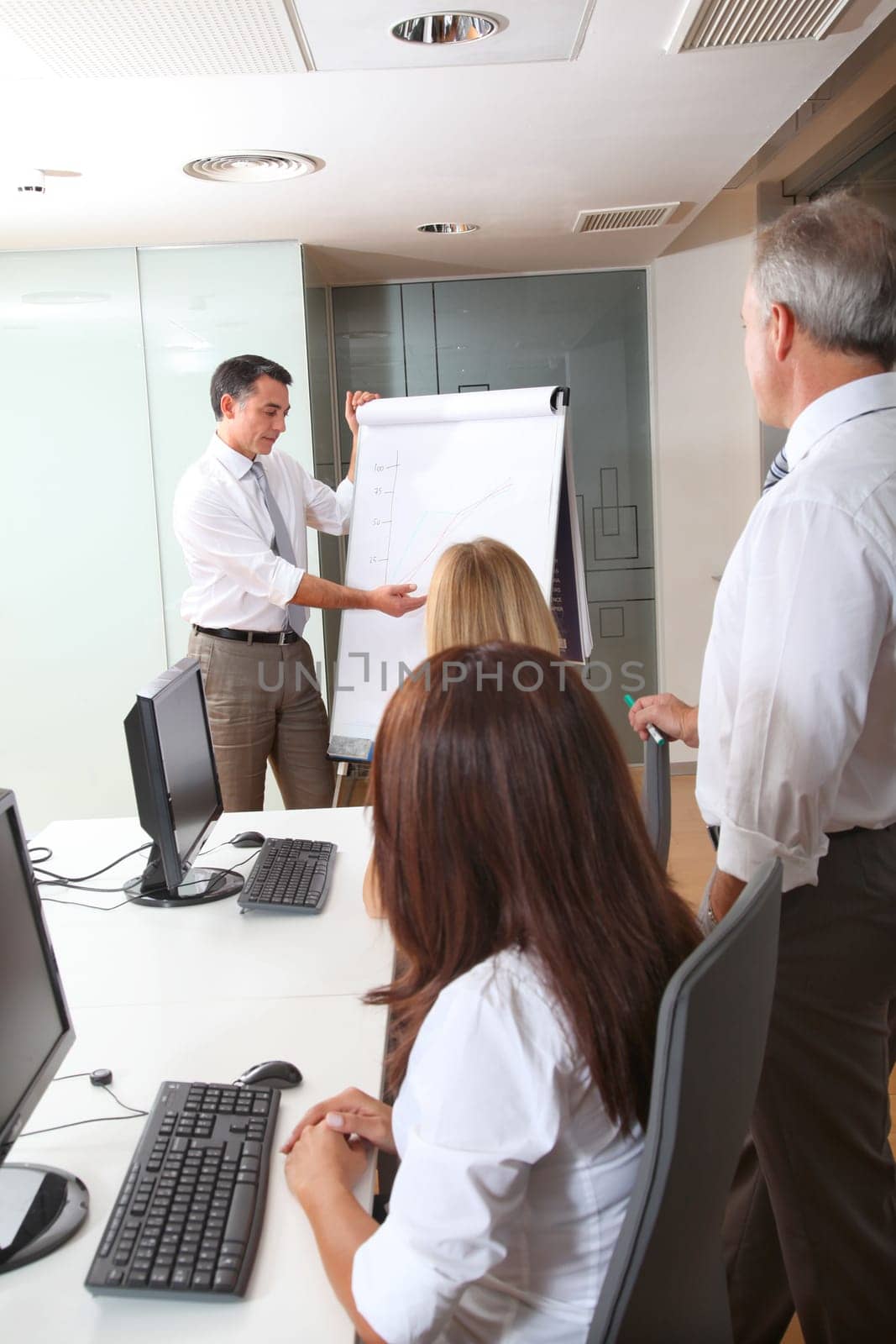 Group of people attending business presentation
