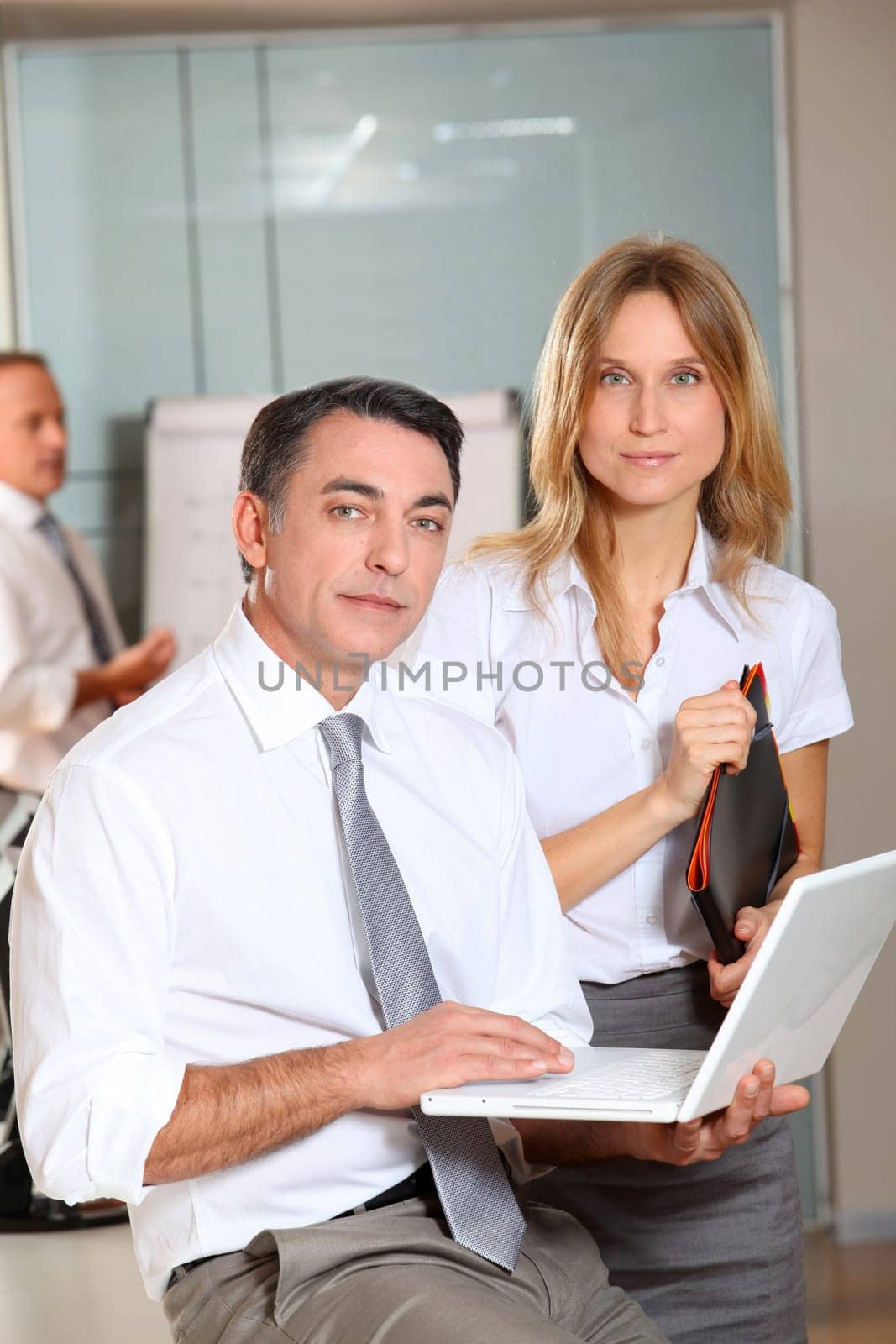 Manager and saleswoman meeting in the office