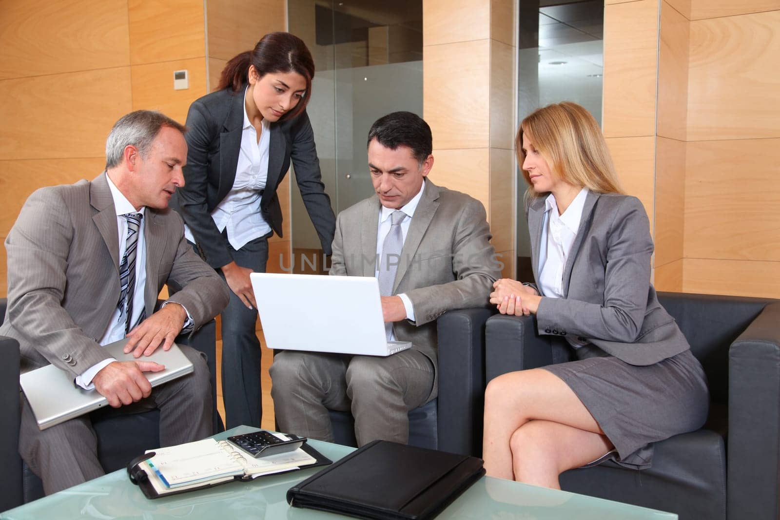 Group of associates meeting in lounge
