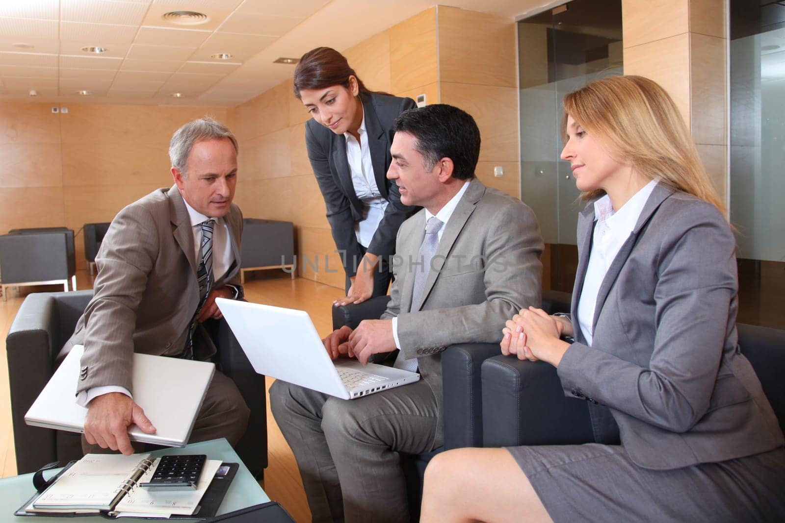Group of associates meeting in lounge