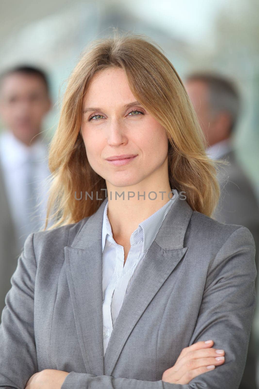 Closeup of blond businesswoman standing outside