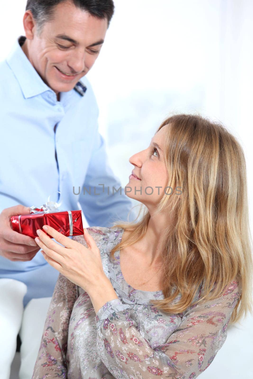 Man giving a present to woman