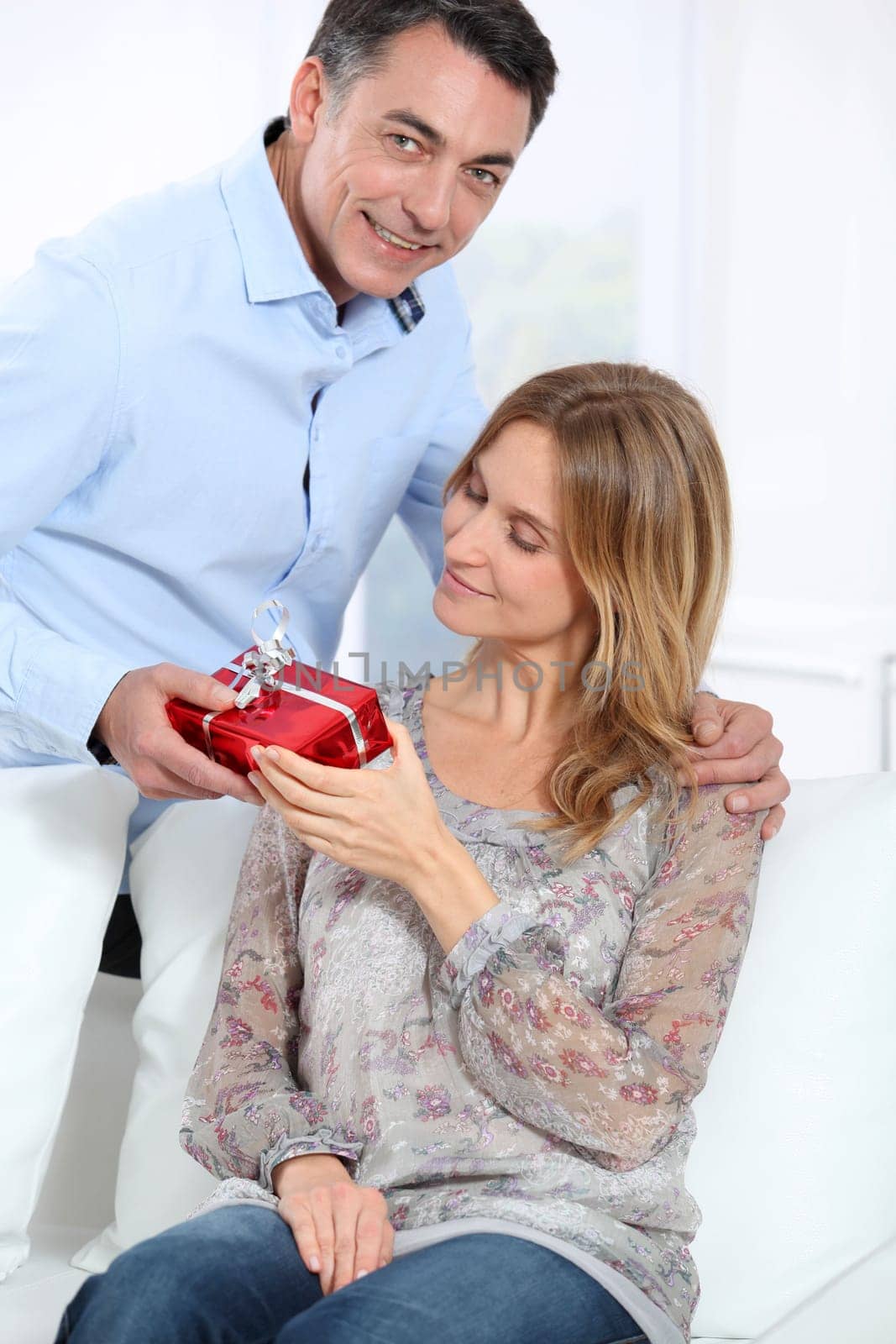 Man giving a present to woman