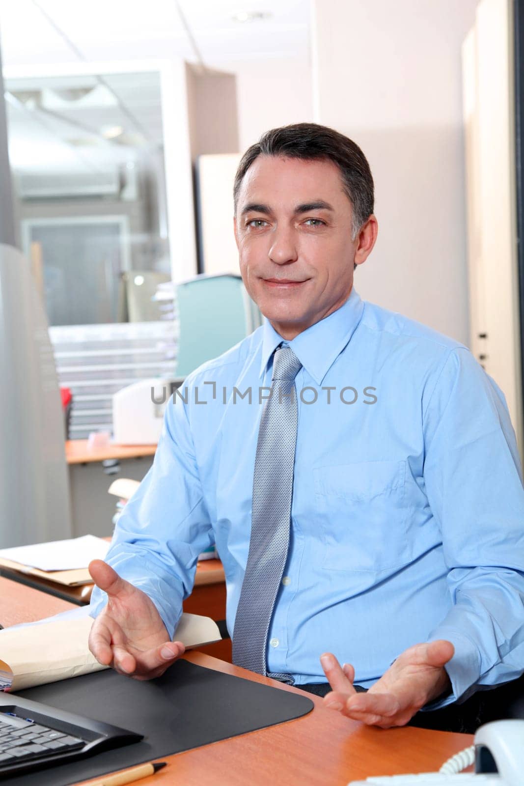 Businessman with blue shirt working in the office