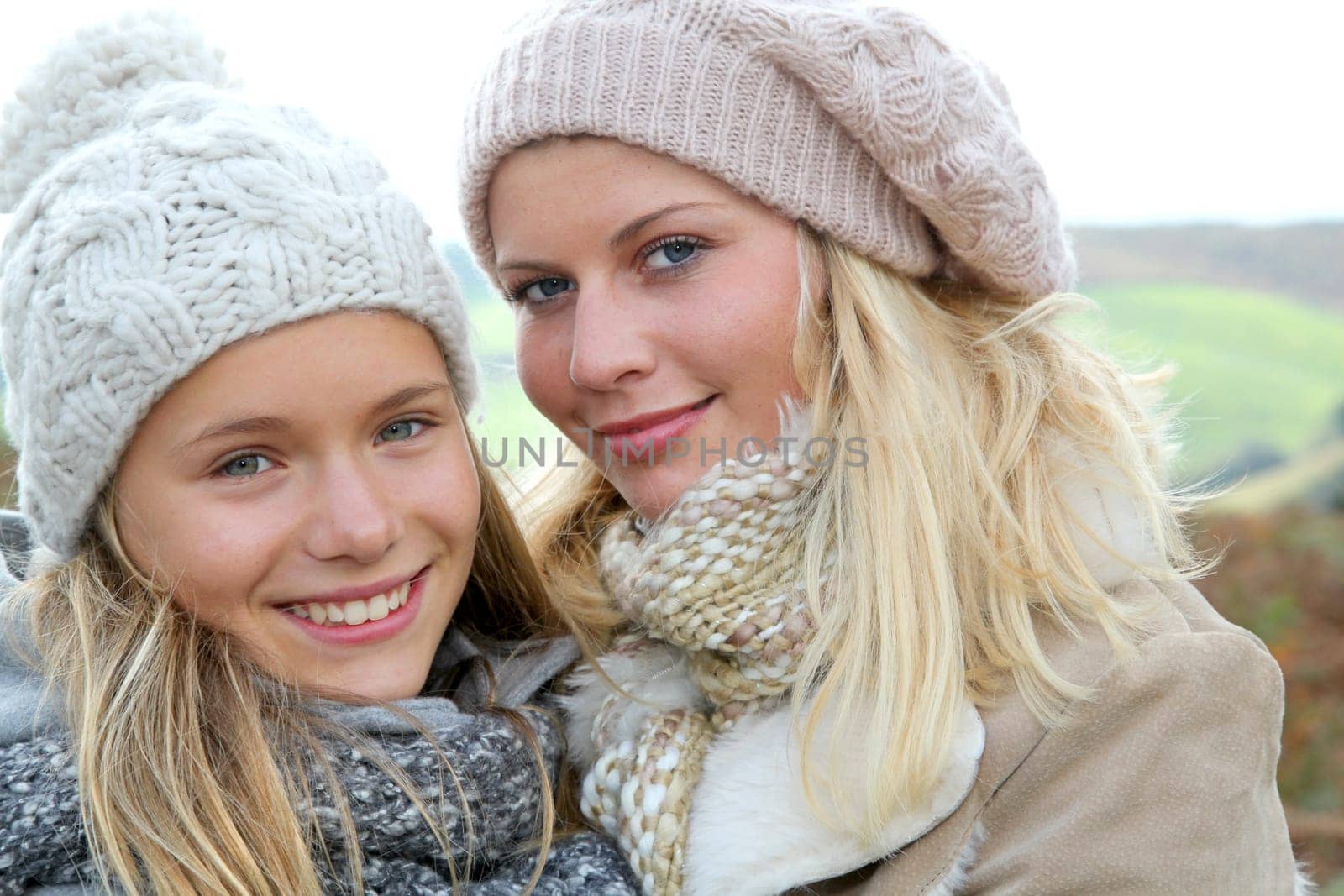Closeup of mother and daughter in fall