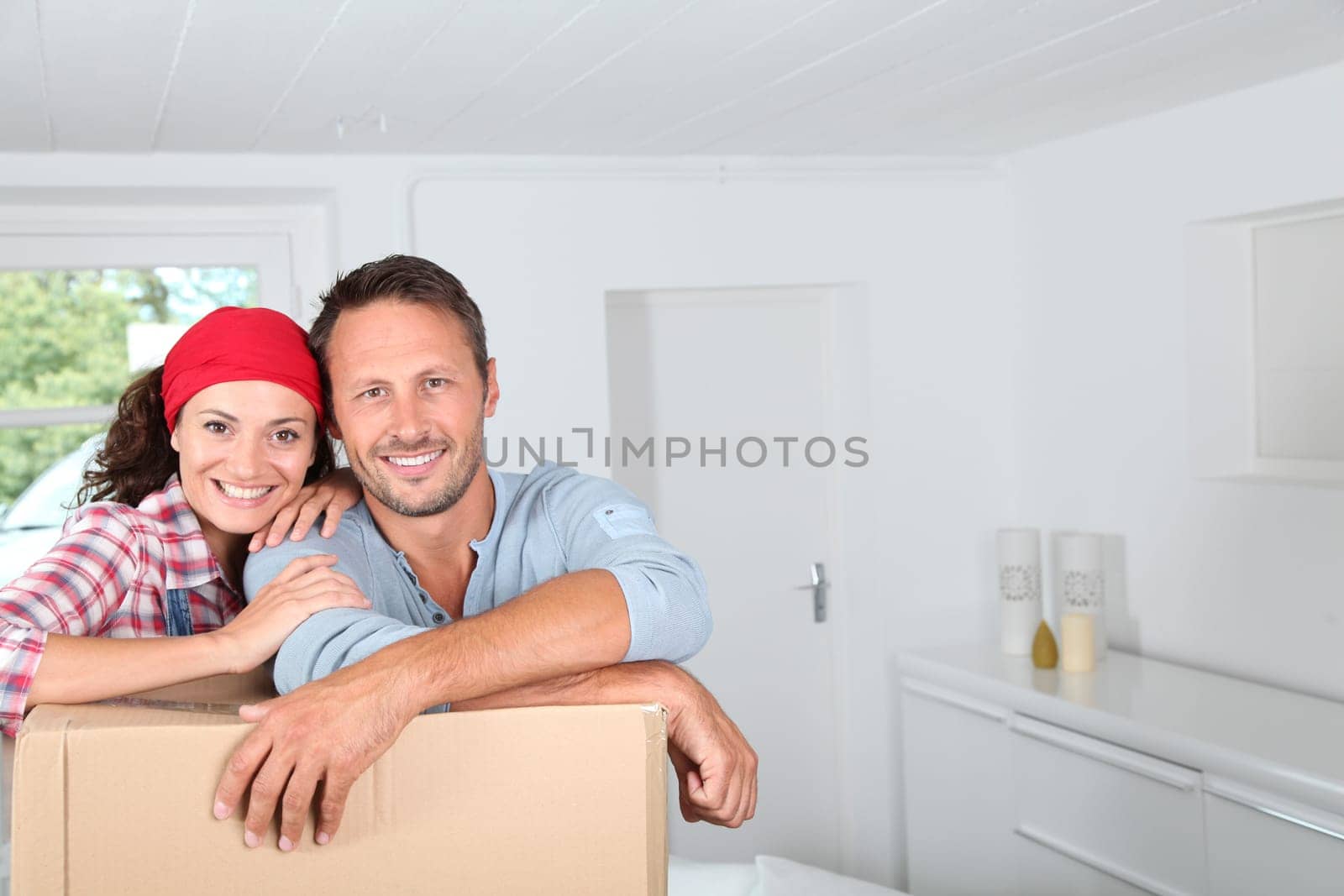 Closeup of couple resting on boxes