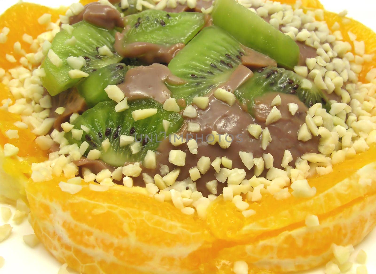 Chocolate pudding with kiwi,orange and almonds