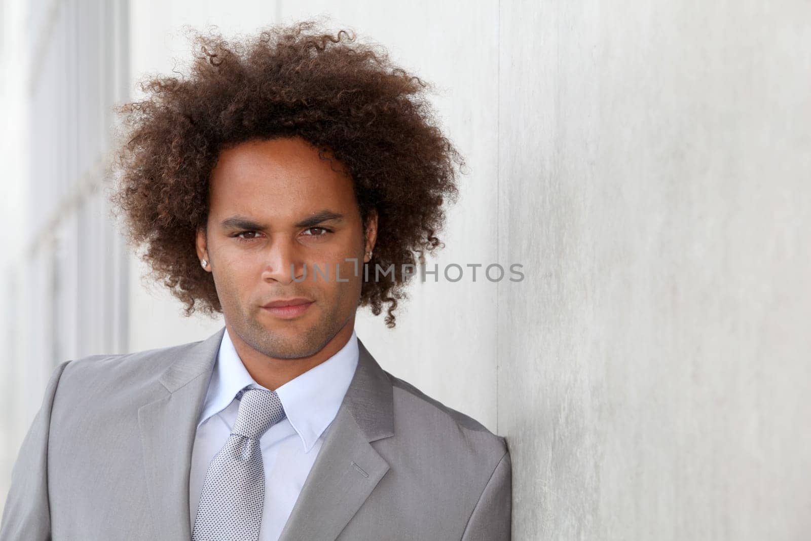 Portrait of a businessman in grey suit