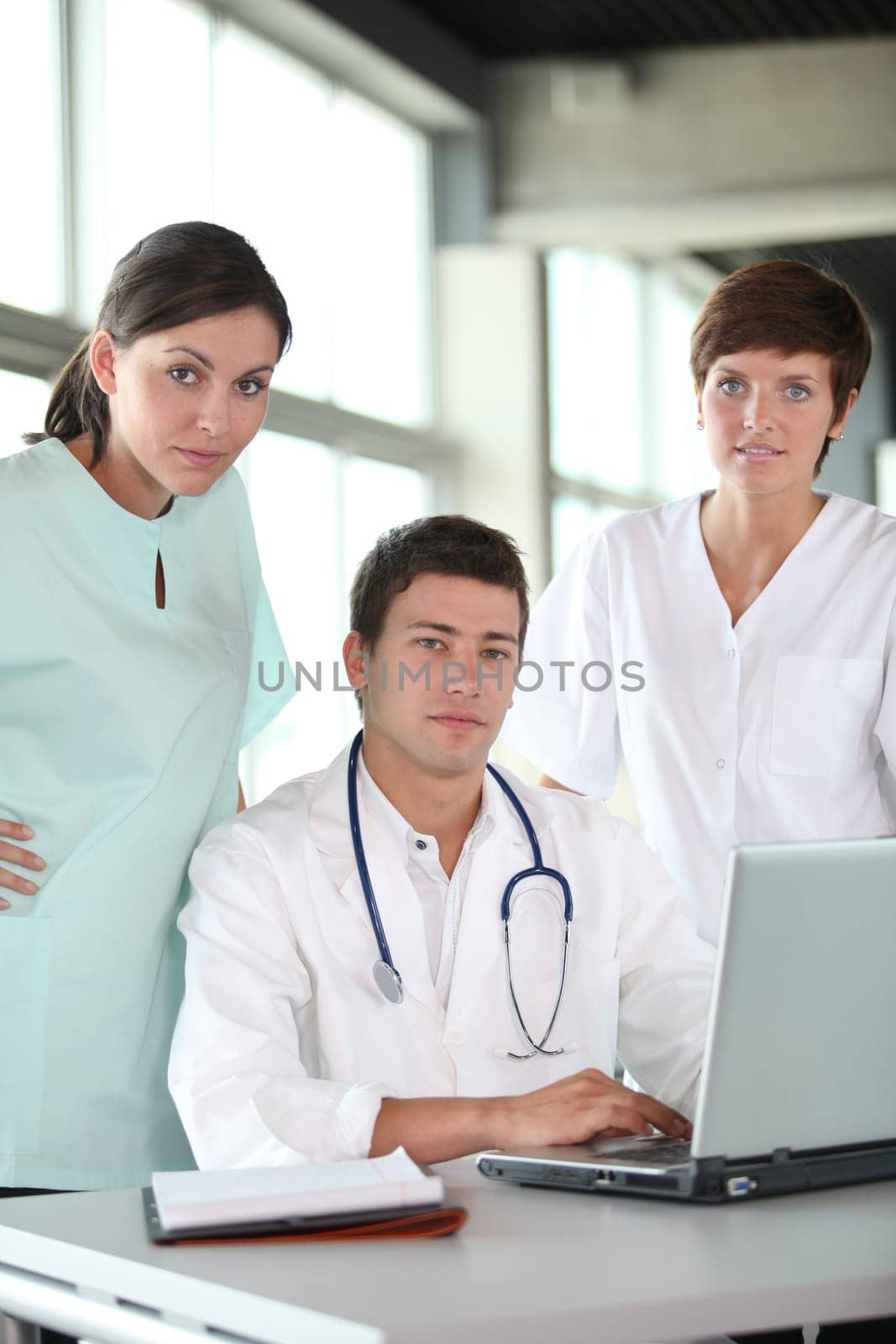 closeup of doctor and nurses in a meeting