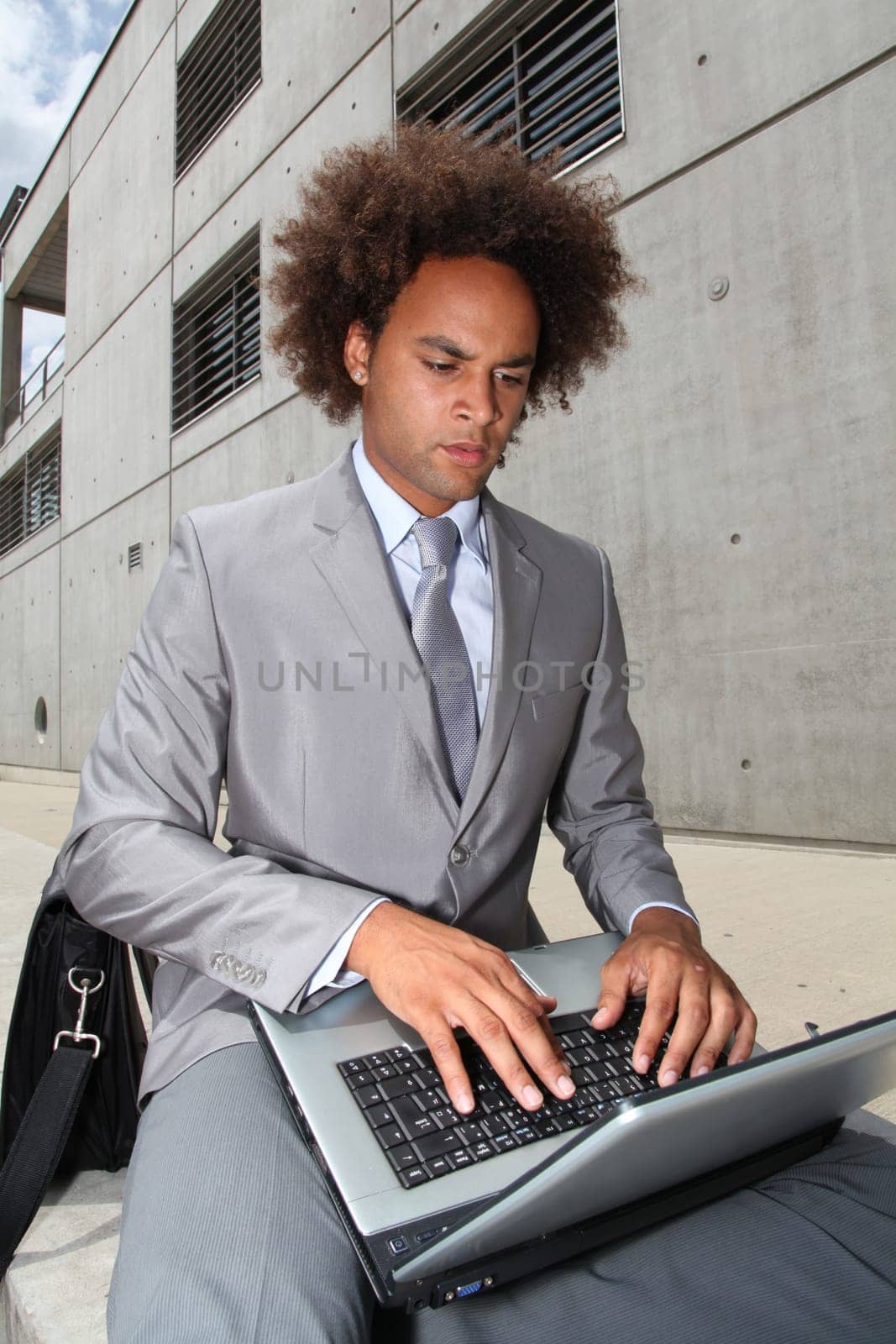 Young businessman working oustide the office