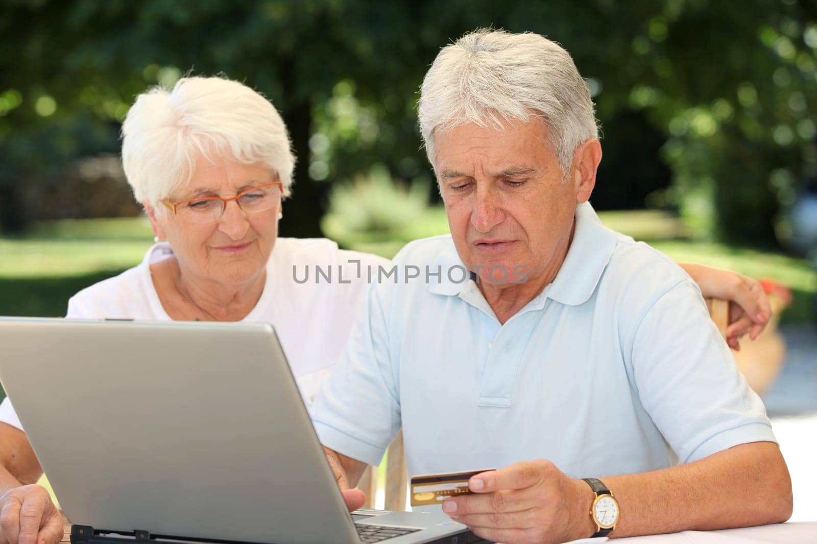 Senior couple doing online shopping