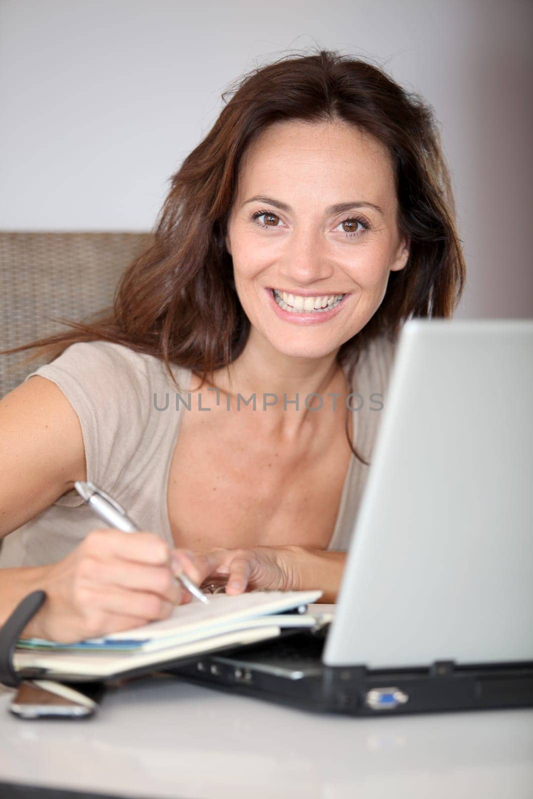 Woman working at home on laptop computer