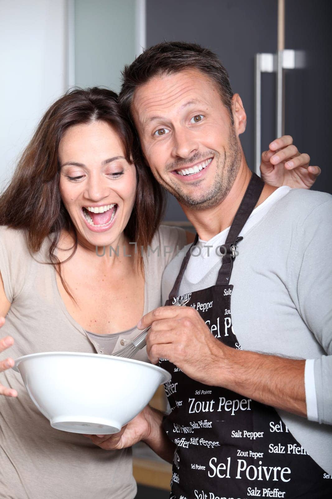 Couple having fun cooking at home