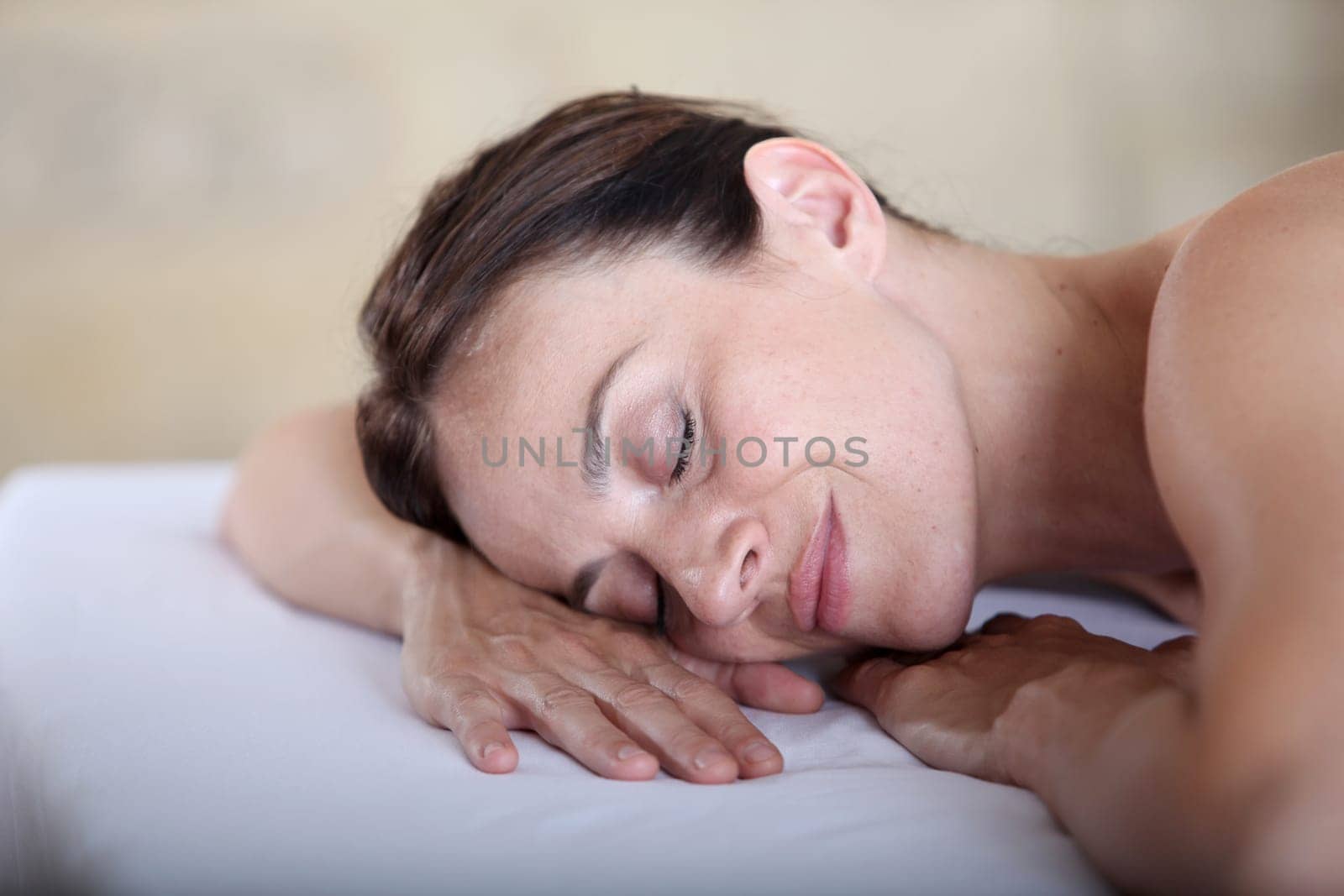 Woman relaxing on a massage bed