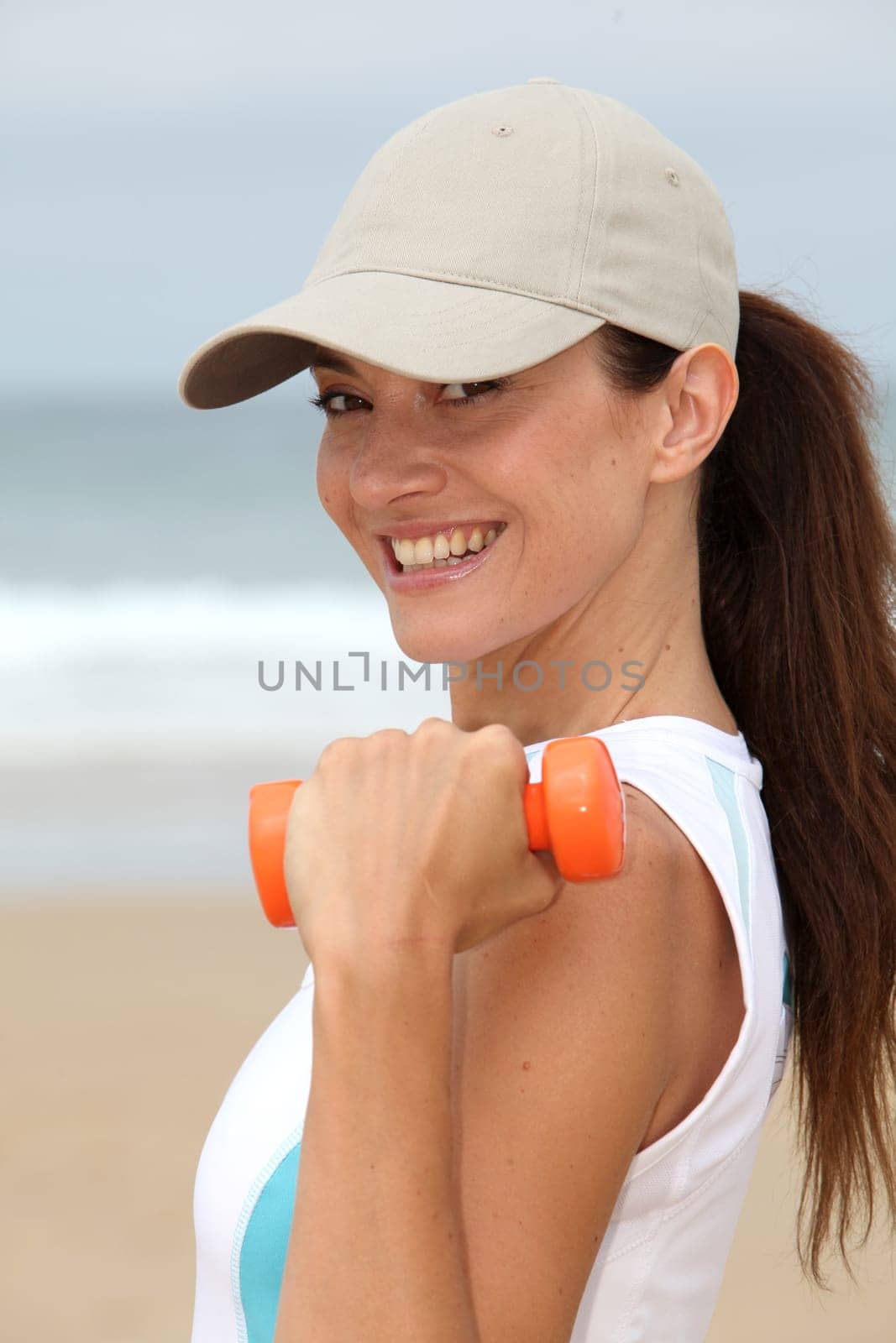 Woman doing exercises on the beach