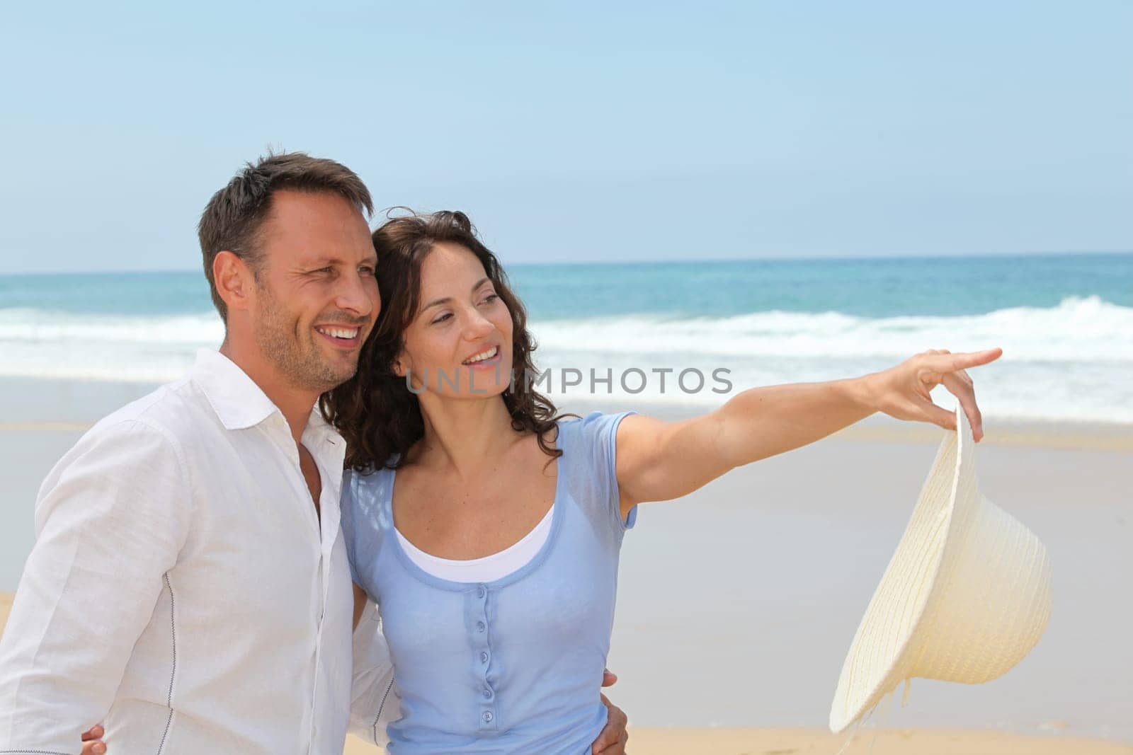 Smiling couple on vacation at the beach