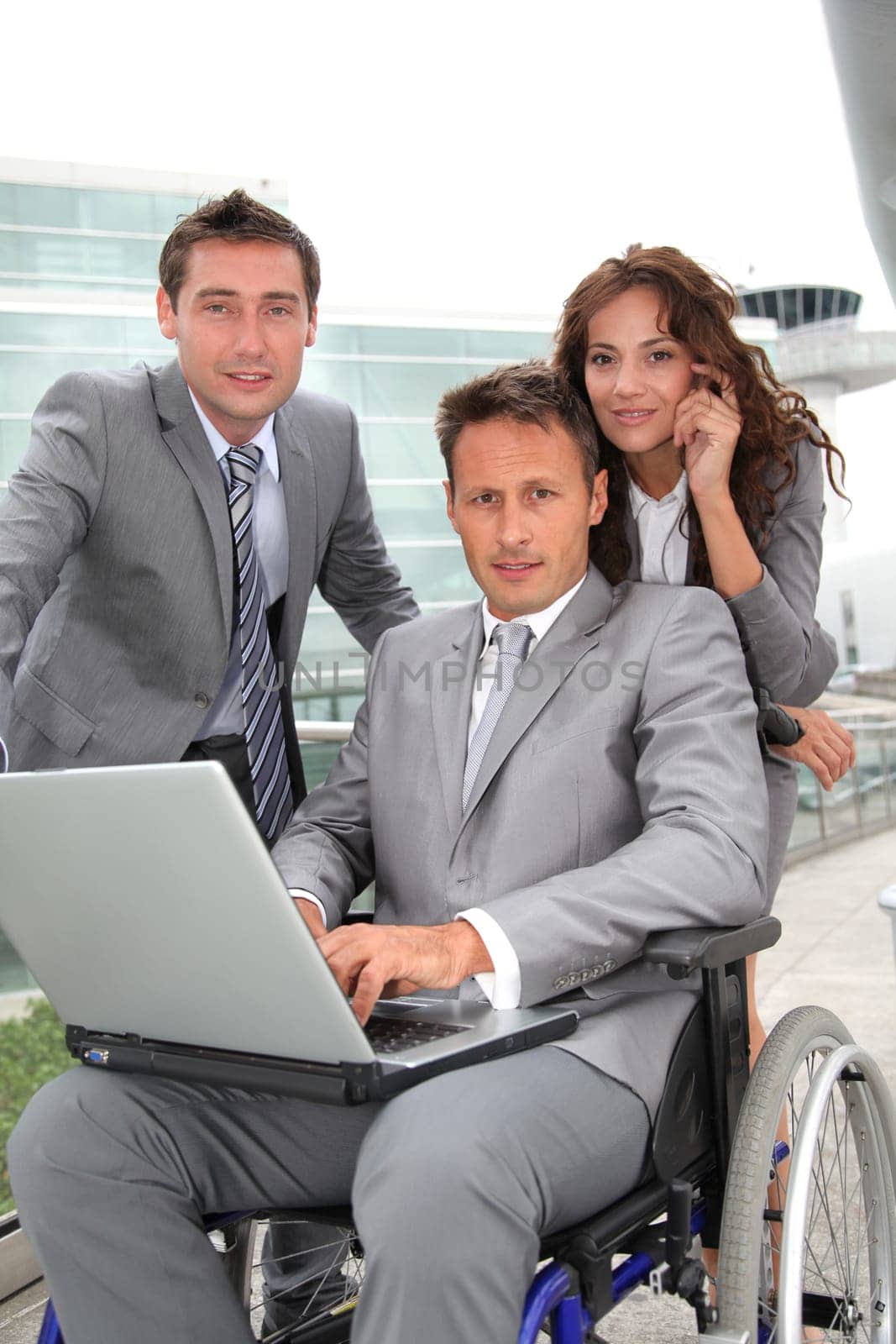 Man in wheelchair in business travel