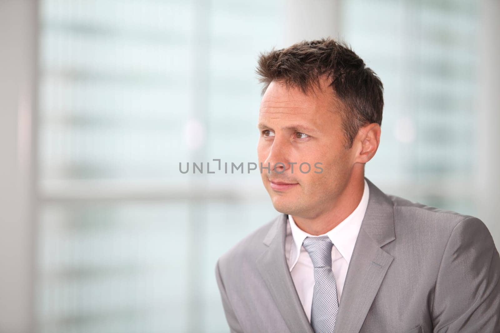 Portrait of businessman in grey suit