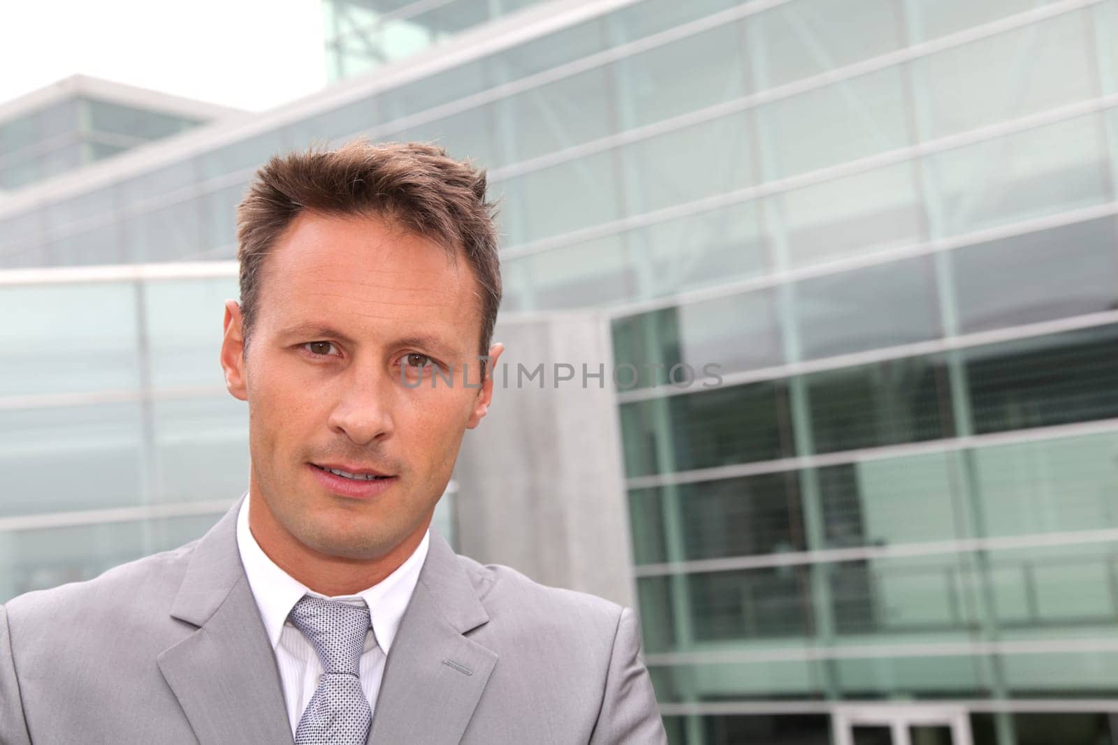 Portrait of businessman in grey suit