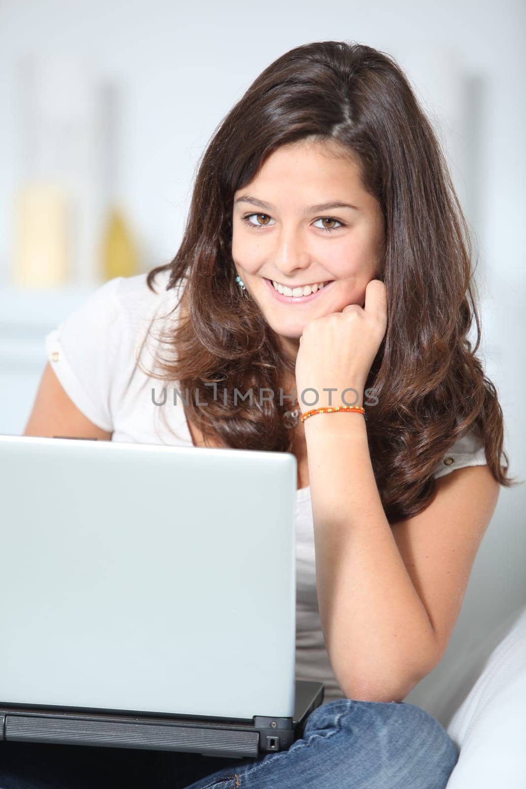 Closeup of teenager girl with laptop computer