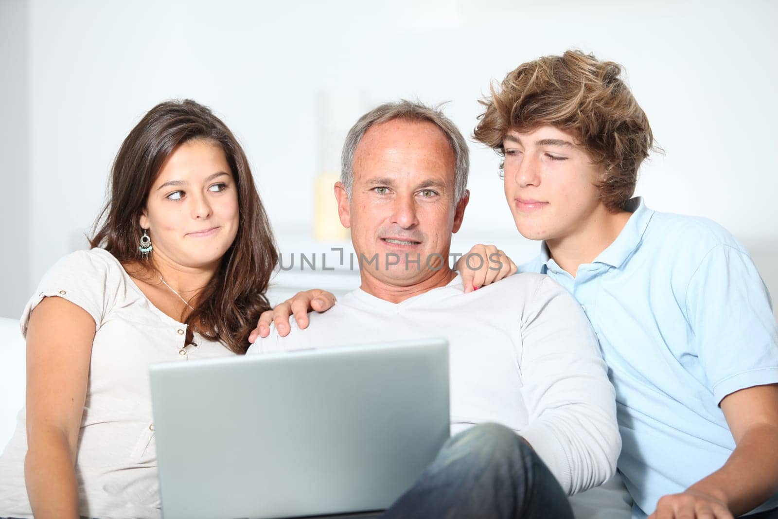 Family at home with laptop computer