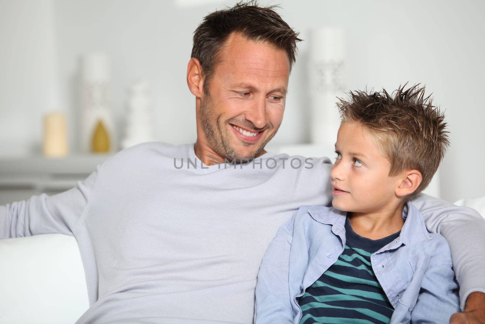 Closeup of father and son at home