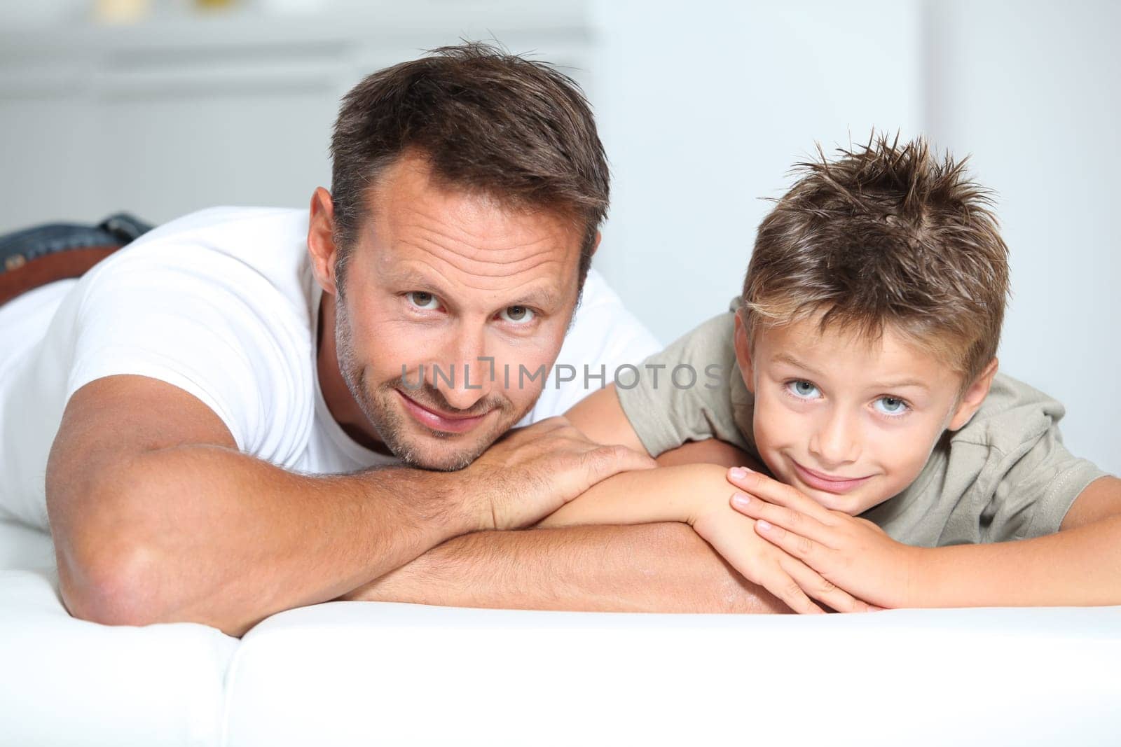 Closeup of father and son at home