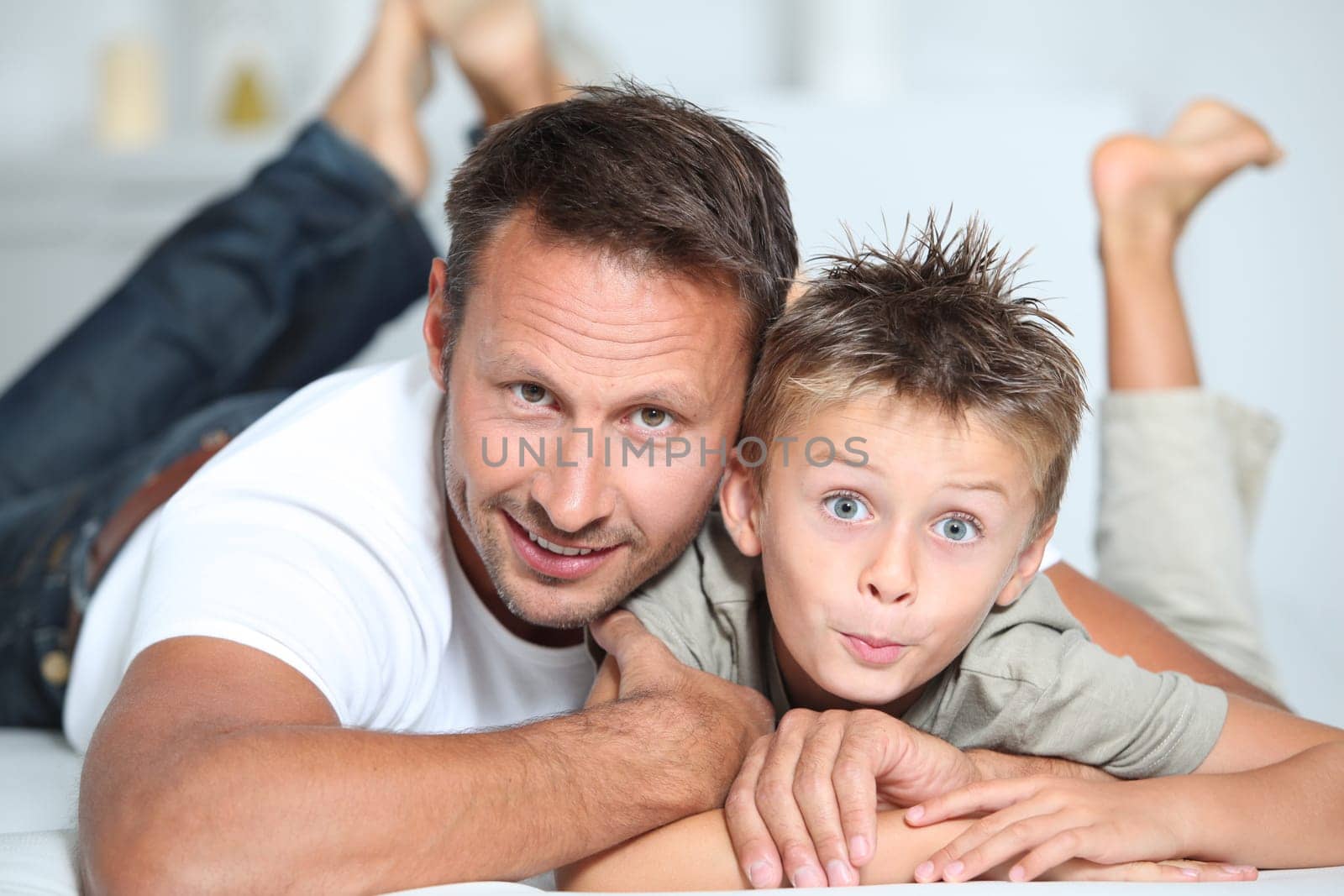 Closeup of father and son at home