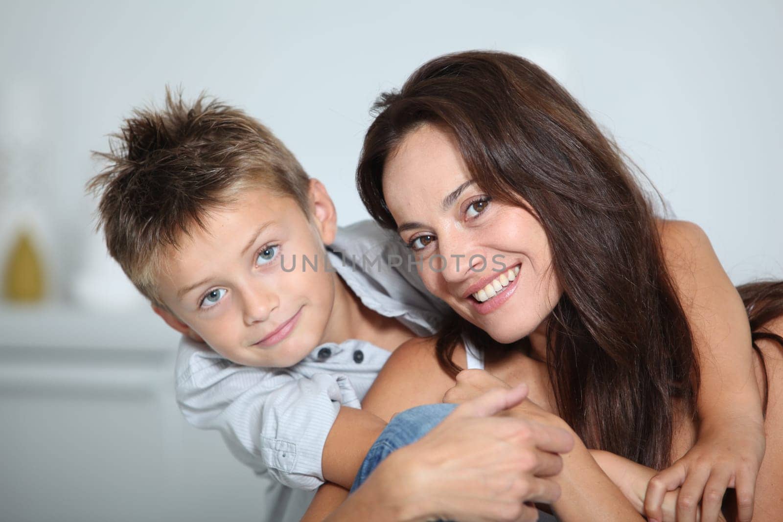 Closeup of mother and child smiling