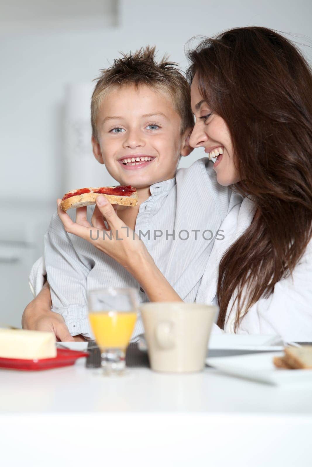 Mother and son having breakfast