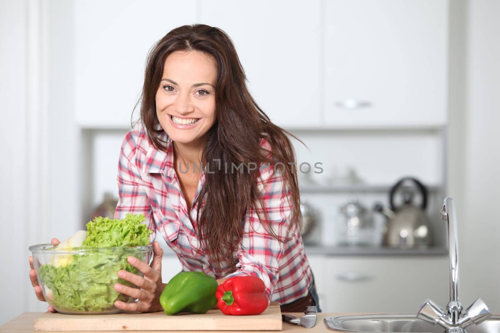 Beautiful woman stading in kitchen