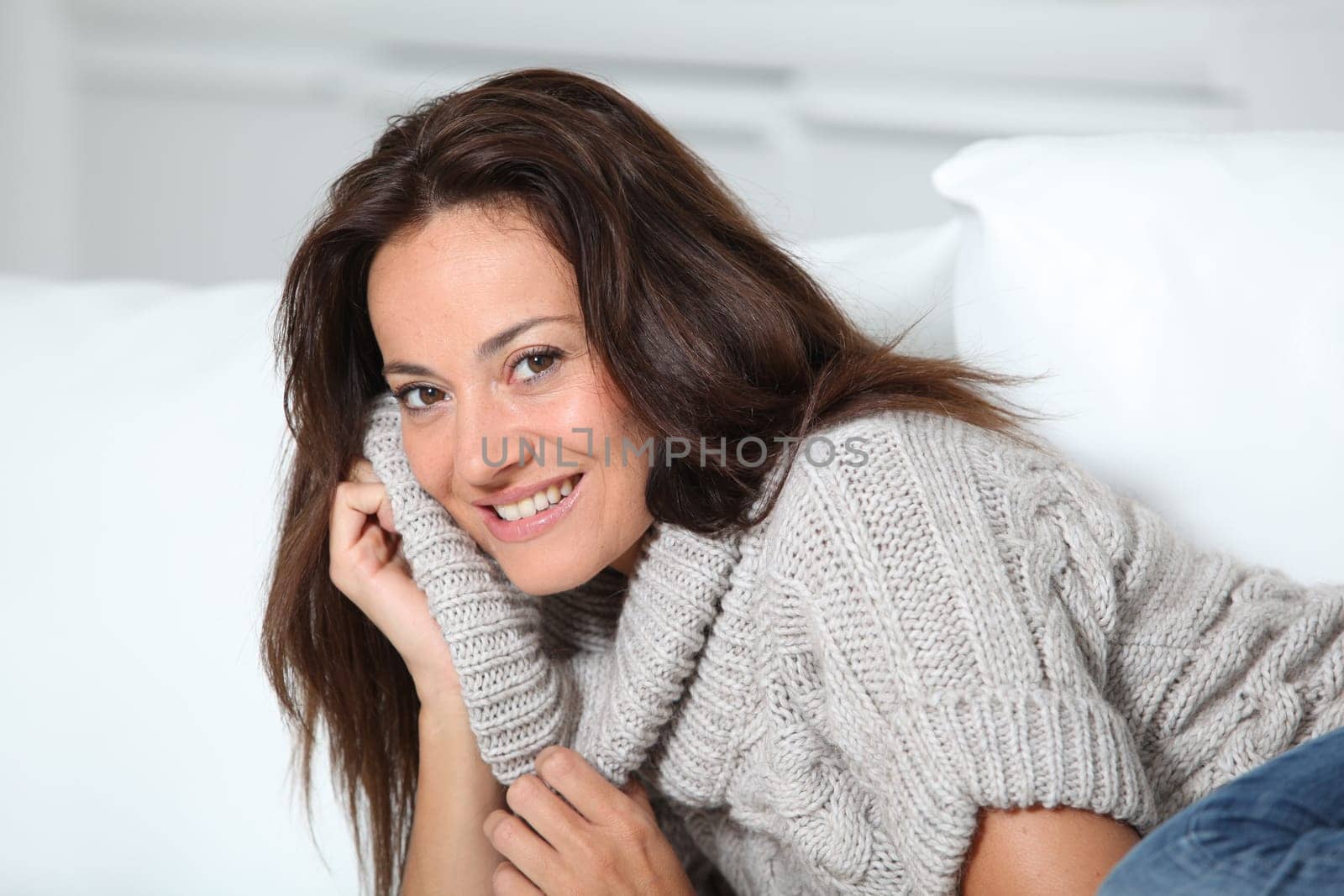 Beautiful woman relaxing on sofa at home