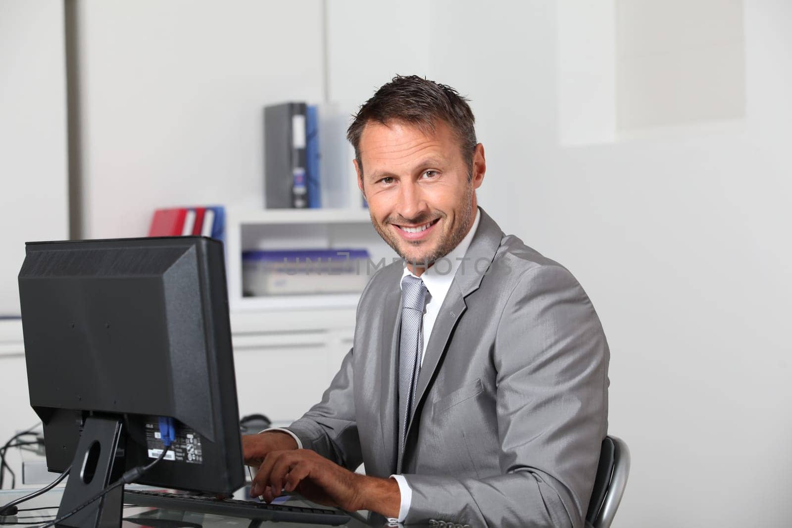 Closeup of businessman at his desk