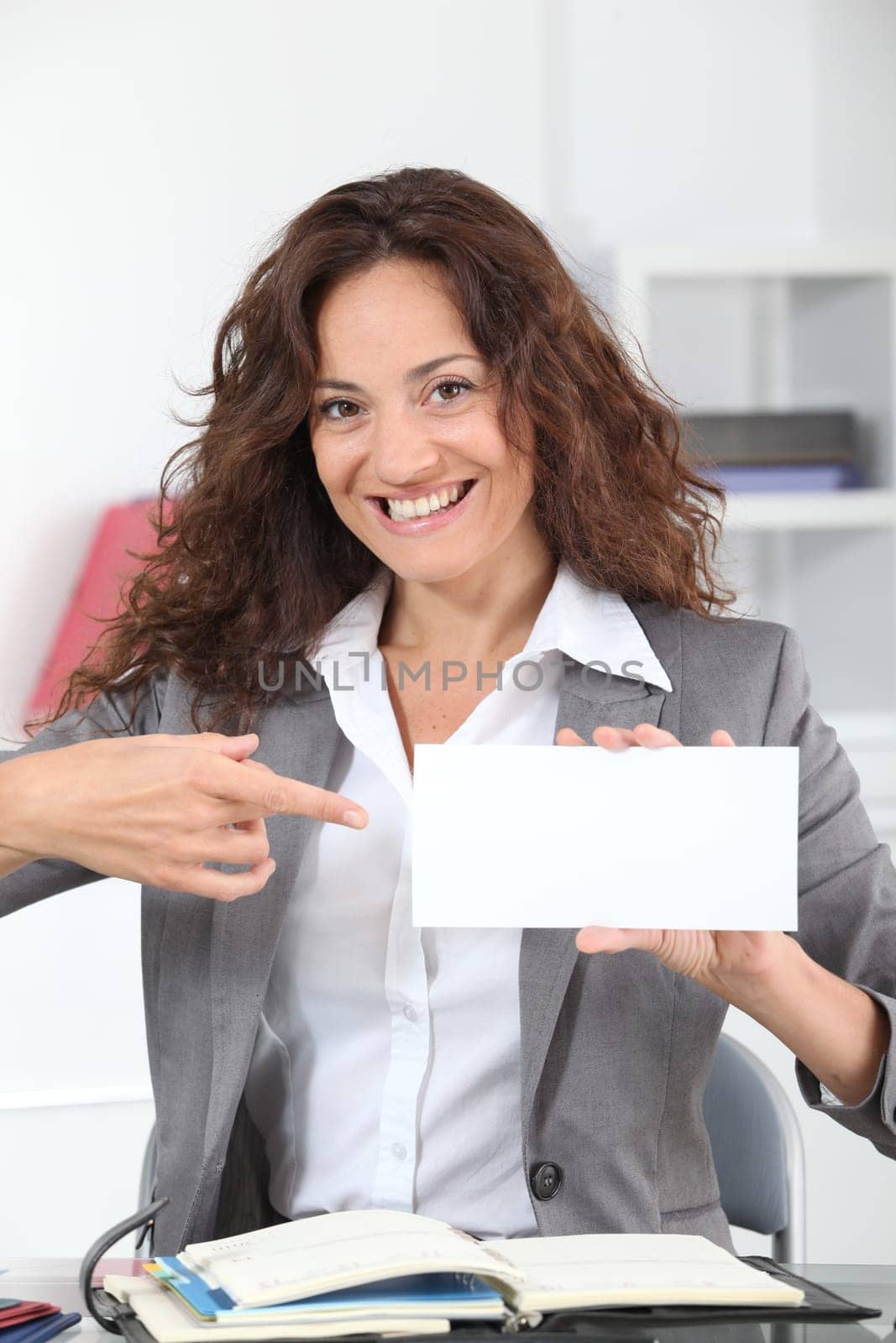 Businesswoman showing business card