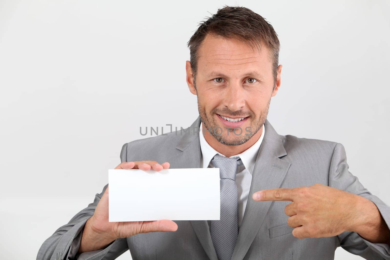 Businessman holding business card